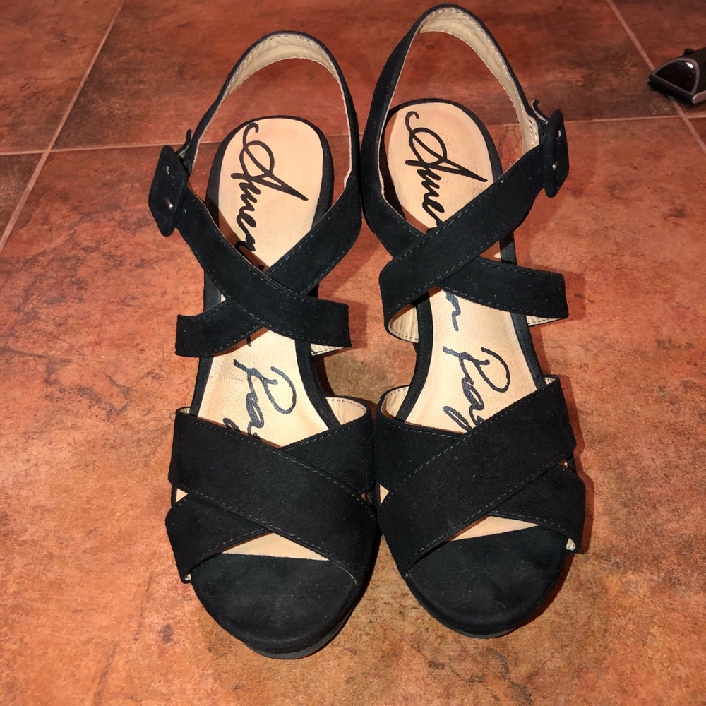Black wedges with a cross design